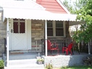 curved front view awning with fringe