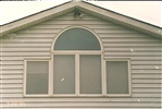 Four casement windows with arch center